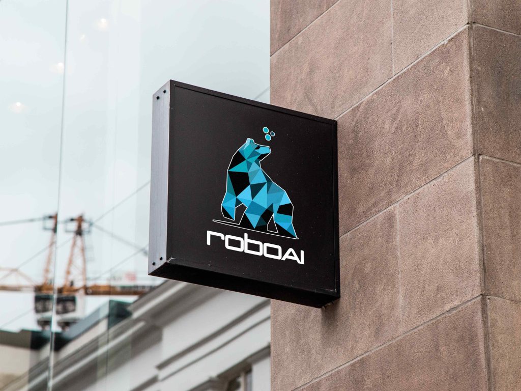 A sign on the wall with RoboAI logo.
