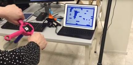 The picture shows a patient using a controller to play a game.