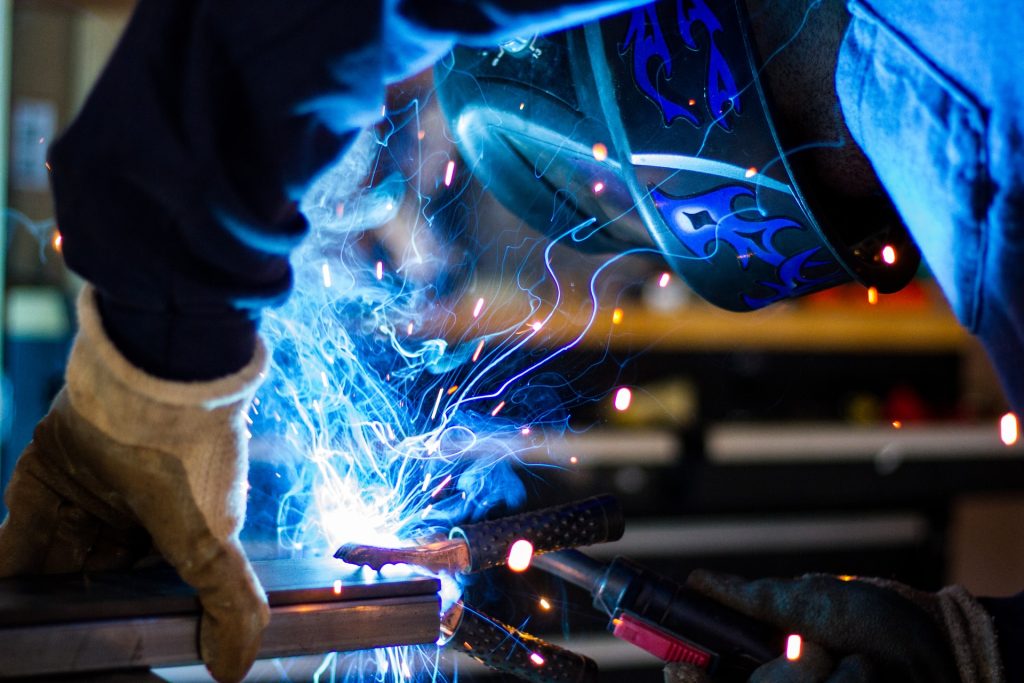 Welding with a blue light.