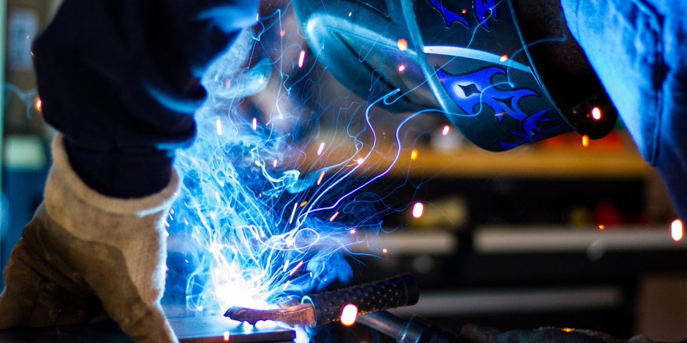 Welding with a blue light.