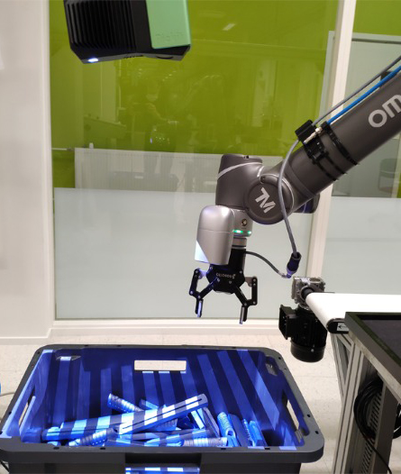 A robot picks up the right pieces with the help of machine vision camera.