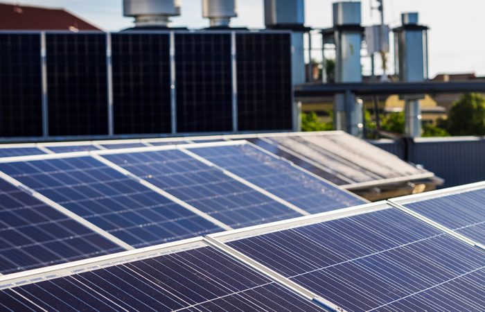 There are sun energy panels on the roof.