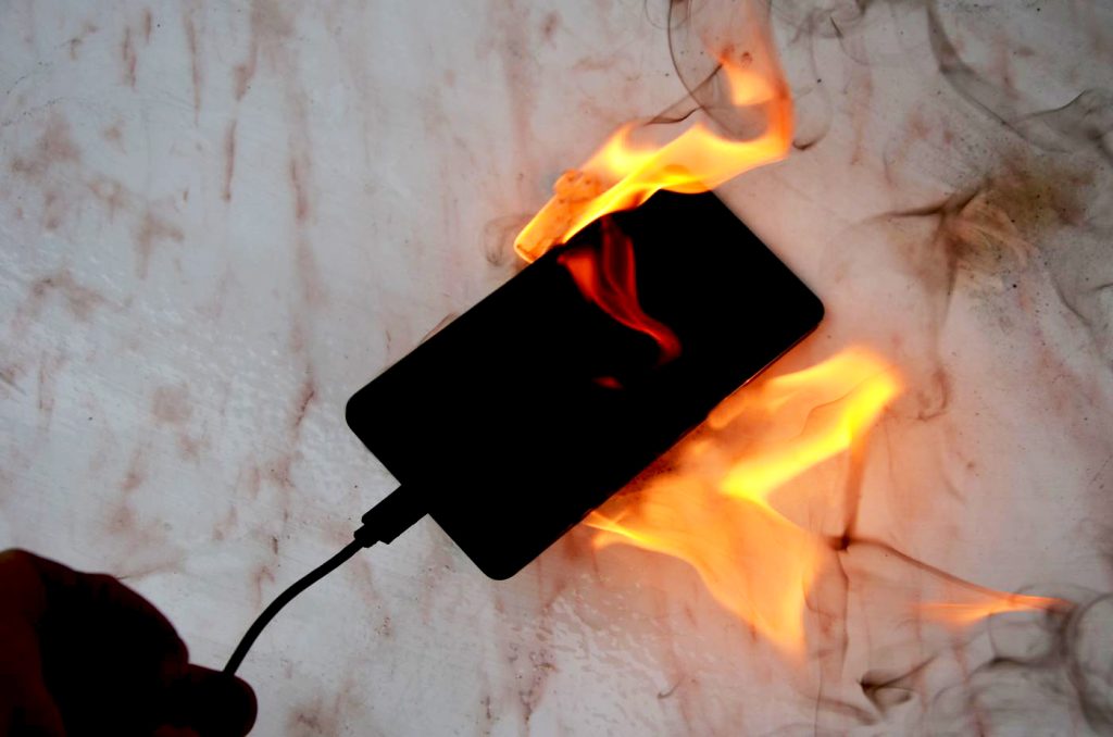 The picture shows a mobile phone on fire.